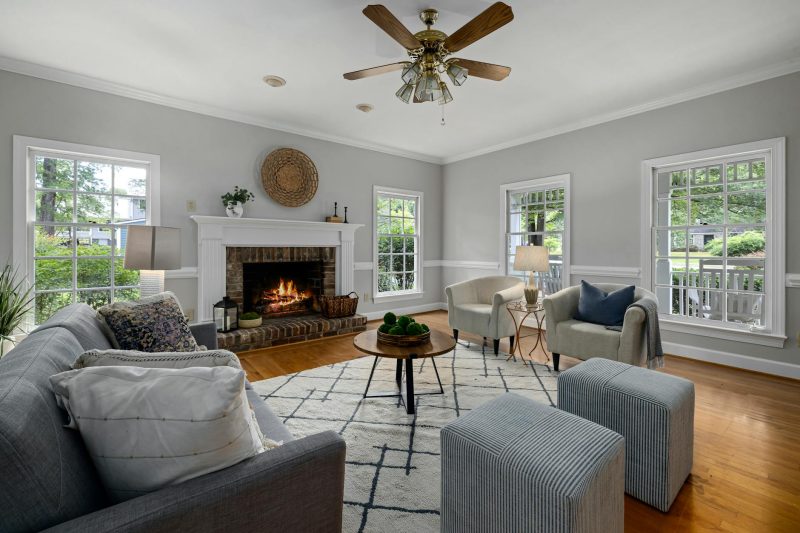 Bright living room with fireplace modern furniture and natur 1777395676