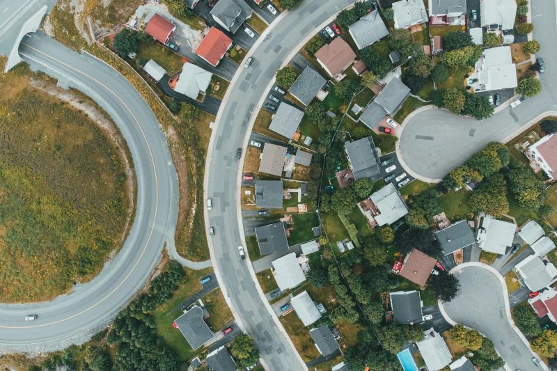 Home 2 Aerial view of a suburban neighborhood with curved roads and 1779210070